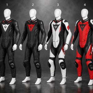 May include: Four motorcycle racing suits displayed on mannequins. The suits are black, red, and white, each featuring the "Dainese" logo on the collar. The suits have knee pads and are designed for protection. The colour schemes vary, with white, red, and black accents.