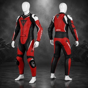 May include: A red, black, and white motorcycle racing suit. The suit is displayed on a mannequin, showcasing the front and back views. The suit features a high collar, elbow and knee protection, and the brand name "Dainese". The suit is designed for motorcycle racing.