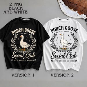 May include: Two t-shirts, one black and one white, each featuring a graphic design. The design includes a goose illustration within a laurel wreath, the words "PORCH GOOSE" and "Social Club", and the phrase "GOTTA GO DRESS MY GOOSE".