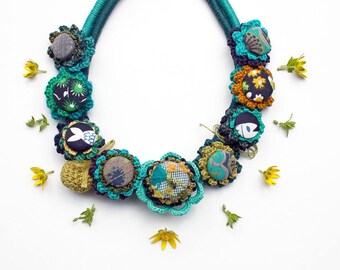 Statement necklace, crochet with fabric buttons, metal pendant and embroidery, OOAK