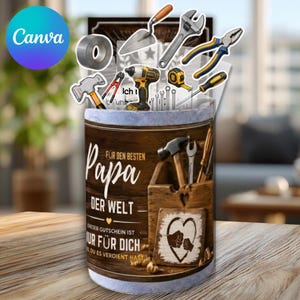 May include: A cylindrical gift container with a wooden toolbox design, featuring various tools and the text "Für den besten Papa der Welt" (For the best Dad in the world). The design includes a heart with hands and the text "Nur für dich" (Only for you).