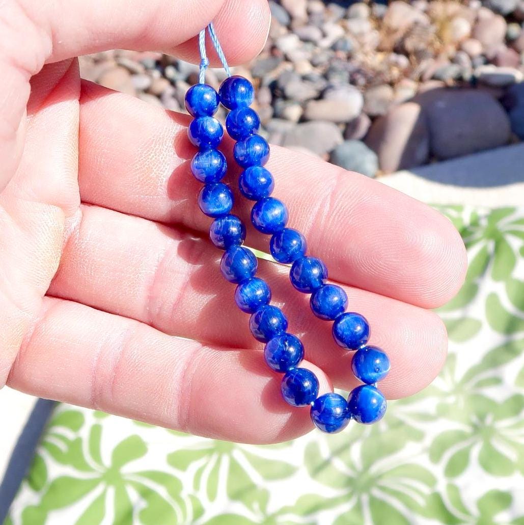 22 cuentas redondas lisas de cianita azul real, ojo de gato, AAAAA, raras, de 5,50" y 52,10 cts.