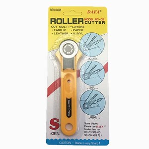 May include: Yellow and silver rotary cutter for cutting fabric, paper, leather, and vinyl. The package includes the text "ROLLER CUTTER" and "DAFA". The cutter has a round blade and a yellow handle. The package also includes diagrams showing how to use the cutter.