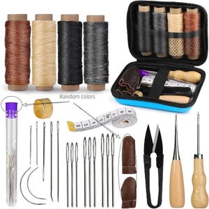 May include: A sewing kit with various tools and supplies. Includes spools of thread in brown, tan, black, and gray. Also features needles, a thimble, a measuring tape, scissors, a leather finger protector, and a seam ripper. The kit is in a blue case.
