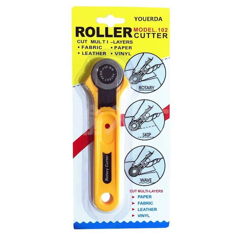 May include: Yellow and black rotary cutter for fabric, paper, leather, and vinyl. The package includes the text "ROLLER CUTTER" and "CUT MULTI-LAYERS". The cutter has a yellow handle and a silver blade. The package also shows different cutting styles.