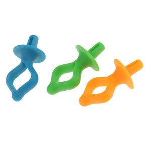 May include: Three plastic fasteners in blue, green, and orange. Each fastener features a circular base, a central diamond-shaped opening, and a protruding cylindrical top piece with a vertical slot, designed for securing fabric or other materials.