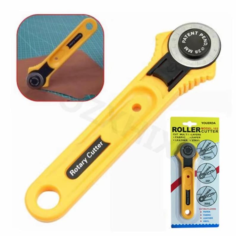 May include: Yellow rotary cutter with a black blade housing and a circular blade. The handle has the words "Rotary Cutter" printed on it. The packaging indicates it cuts multi-layers of fabric, paper, leather, and vinyl.