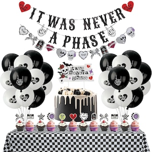 May include: A party decoration set featuring a black glitter banner reading IT WAS NEVER A PHASE, black and white balloons with skeleton hand and heart graphics, a cake topper with the same text, and cupcake toppers on a checkered tablecloth.