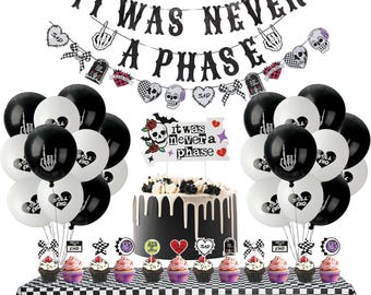 May include: A party decoration set featuring a black glitter banner reading IT WAS NEVER A PHASE, black and white balloons with skeleton hand and heart graphics, a cake topper with the same text, and cupcake toppers on a checkered tablecloth.