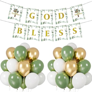 May include: A party decoration set featuring a banner that reads "GOD BLESS" in gold letters, with floral accents. Below are two clusters of balloons in white, gold, and green. The banner includes a cross and the words "God Bless".
