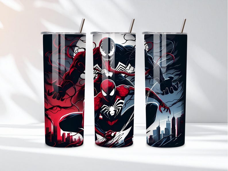 May include: Three stainless steel tumblers with superhero designs. The first features a red and black character, the second has Spider-Man, Venom, and a third character, and the third has a dark character with a city skyline.