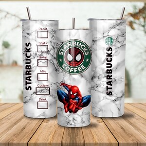 May include: Three stainless steel Starbucks tumblers with a marble effect. One features a Spider-Man graphic and the Starbucks logo. The other two have the Starbucks logo and a drink customization chart. Each tumbler has a silver straw.