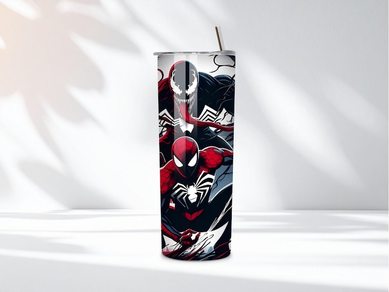 May include: A stainless steel tumbler featuring a vibrant design of Spider-Man, Venom, and their logos. The tumbler has a black, red, and white color scheme, with a silver straw and lid. This insulated tumbler is designed to keep drinks cold or hot.
