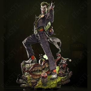 May include: A detailed statue of the Joker, a DC Comics villain, in a dynamic pose. He wears a purple suit, green hair, and a sinister grin, holding a gun. The base features a chaotic scene with bombs and a Harley Quinn figure.