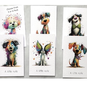 May include: A set of six white greeting cards featuring colourful, whimsical illustrations of various dogs. Some cards display the text 'A little note' at the bottom, while one card includes the text 'Choose from 3 or 6 Pack' at the top.