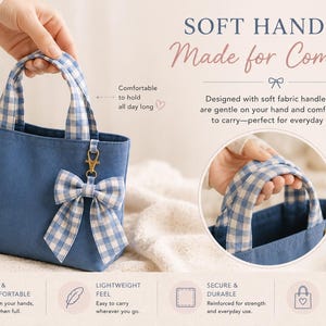 A blue canvas tote bag featuring blue and white gingham patterned fabric handles and a matching gingham bow charm. The bag includes text stating SOFT HANDLES, Made for Comfort, and highlights features like soft fabric handles and durable construction.