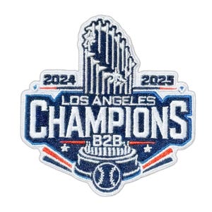May include: A blue and white embroidered patch commemorating the Los Angeles Champions. The patch features the text "LOS ANGELES CHAMPIONS" and the years "2024" and "2025". A baseball is at the bottom.