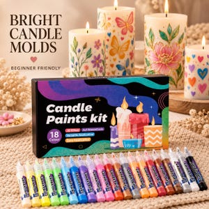 Peut inclure: Un kit de peinture pour bougies comprenant 18 couleurs et 18 tubes de peinture individuels. L'emballage porte l'inscription "Candle Paints kit" et "3D EFFECT". Quatre bougies allumées ornées de motifs floraux, de papillons et de cœurs sont visibles.