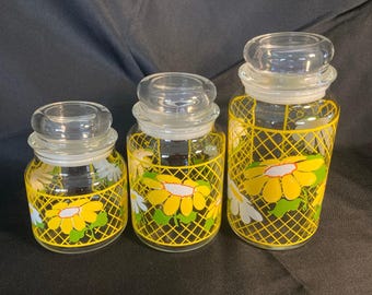 1970s Anchor Hocking Hildi Yellow Daisy Canister Set 3 Glass Lidded USA