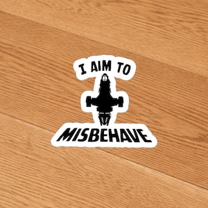 May include: A set of three ceramic mugs with a speckled, matte finish. The mugs are in shades of cream, light gray, and dark gray. Each mug has a simple, modern design and a rounded handle. The mugs are likely for coffee or tea.