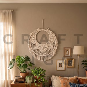 May include: A bedroom scene with a macrame wall hanging, a wooden chest of drawers with plants, and a bed with cushions. The room has a neutral colour scheme and natural light.