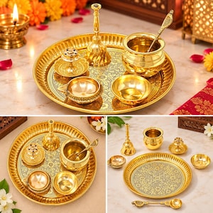 May include: A gold-toned brass puja thali set featuring a round engraved tray, a bell, a small pot with a spoon, an incense holder, and two small bowls. The set includes various ritual items with polished surfaces and intricate floral patterns.