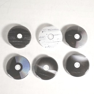 May include: Six round, black and white coasters with various designs. Each coaster has a central white circle. The designs include striped, speckled, and gradient patterns, creating a modern, minimalist aesthetic. These coasters are ideal for protecting surfaces from drink rings.