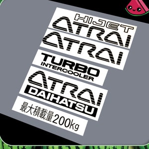 May include: White stickers with black text. The stickers say "HIJET", "ATRAI", "TURBO INTERCOOLER", "ATRAI", "DAIHATSU", and "最大積載量200kg".