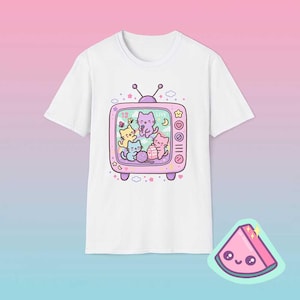 White pastel retro TV cat shirt featuring dreamy kawaii cats inside vintage television frame.