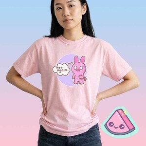 Woman wearing pink funny bunny graphic t-shirt with “not again” text, cute sarcastic pastel mood shirt
