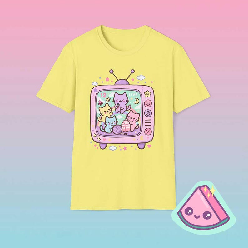Cornsilk yellow retro TV cat shirt featuring dreamy pastel kawaii cats inside vintage television frame.