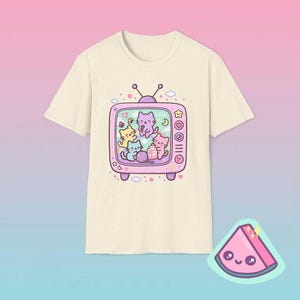 Natural color retro TV cat shirt featuring dreamy pastel kawaii cats inside vintage television frame.