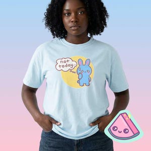 Woman wearing pastel blue funny bunny graphic t-shirt with “not today” text, cute sarcastic introvert shirt