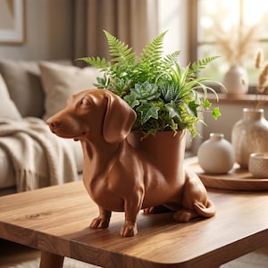 May include: A brown ceramic dachshund dog planter, filled with a variety of green plants. The dog-shaped pot is a decorative item, placed on a wooden table, ideal for home decor.