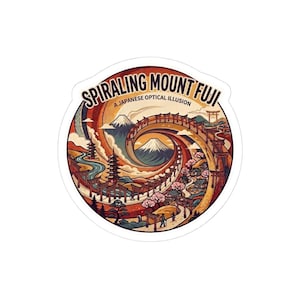 Puede incluir: Una pegatina redonda con una ilustración estilizada del Monte Fuji y un paisaje japonés. El diseño incluye el texto "SPIRALING MOUNT FUJI" y "A JAPANESE OPTICAL ILLUSION" en un estilo retro, con una paleta de colores naranja, rojo y azul.
