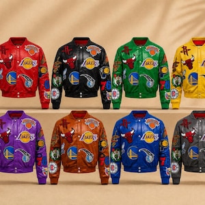 May include: Eight varsity-style jackets in red, black, green, yellow, purple, brown, blue, and gray, each featuring multiple embroidered NBA team logos and patches, including the Chicago Bulls and Los Angeles Lakers, with snap-button closures.