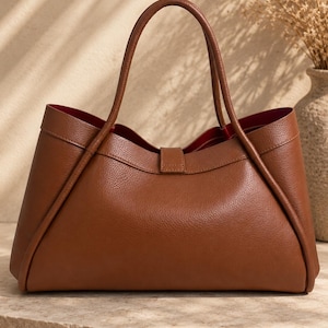 Fashionable genuine leather tote bag for women styled in elegant luxury product photography scene.