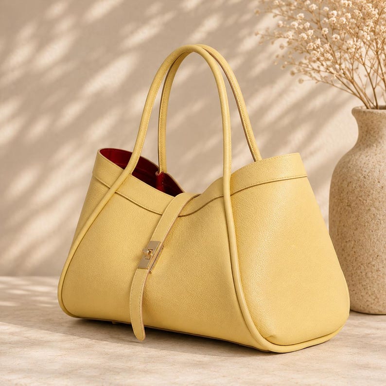 Minimalist leather shoulder bag with premium craftsmanship and timeless everyday carry design for women.