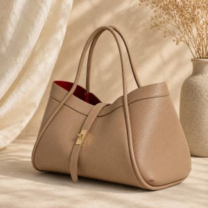 Premium women shoulder handbag crafted from genuine calf leather with sophisticated minimalist luxury styling.