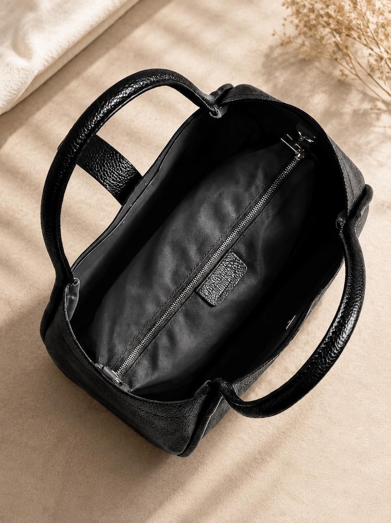 Premium women leather handbag with minimalist designer inspired style and spacious daily carry interior.