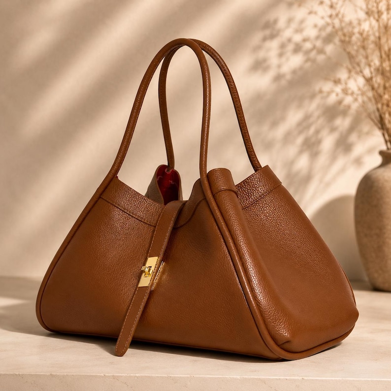 Handmade calf leather shoulder purse with elegant soft structure and timeless modern silhouette.
