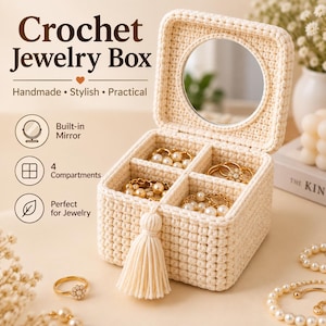 May include: A cream-colored square crochet jewelry box featuring a lid with a built-in circular mirror, four interior compartments, and a decorative tassel on the front. The text reads Crochet Jewelry Box, Handmade, Stylish, Practical, Built-in Mirror, 4 Compartments, and Perfect for Jewelry.