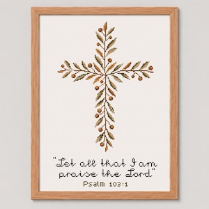 May include: A framed cross-stitch artwork featuring a cross design adorned with olive branch patterns in shades of brown and green. The artwork includes the text "Let all that I am praise the Lord" and "Psalm 103:1". The frame is made of wood.