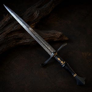 May include: A dagger with a patterned Damascus steel blade, a dark textured handle, and a gold-coloured fleur-de-lis emblem. The crossguard is dark metal, and the pommel features a flared shape with gold-coloured accents at the base of the grip.