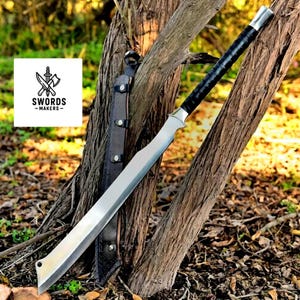 May include: A white ceramic mug with a wraparound design featuring a vibrant, colorful illustration of various mushrooms. The mug has a black handle and a glossy finish, perfect for coffee or tea.