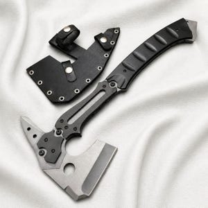 May include: A tactical axe with a black handle and a silver blade, accompanied by a black leather sheath. The axe features a unique design with a sharp edge and a pointed end. The sheath has a belt loop for easy carrying.