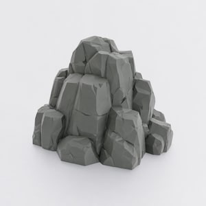 May include: A gray, low-poly style rock formation featuring sharp, angular facets and a geometric structure. The object is composed of multiple interconnected stone-like segments that create a jagged, mountain-like appearance with distinct flat planes.