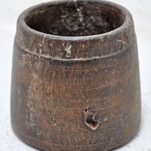 May include: A rustic wooden sign with the text "Welcome to our home" in white lettering. The sign features a distressed finish and a simple, inviting design, perfect for entryway decor.