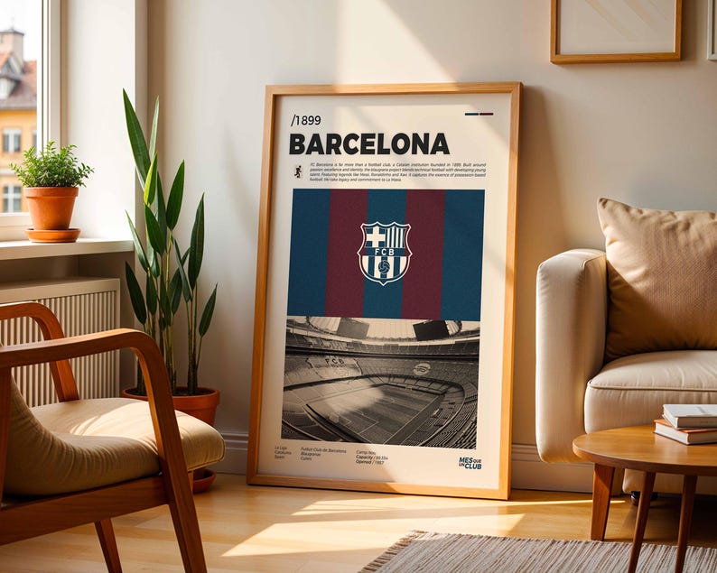 May include: A framed poster featuring the FC Barcelona crest and stadium imagery. The poster has a wooden frame and includes the text "/1899 BARCELONA". The design incorporates the team's colors: blue, maroon, and gold.