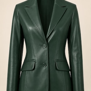 May include: A dark forest green blazer crafted from a smooth, leather-like material. This structured jacket features a notched lapel, long sleeves, two front flap pockets, and a two-button closure centered on the front placket.